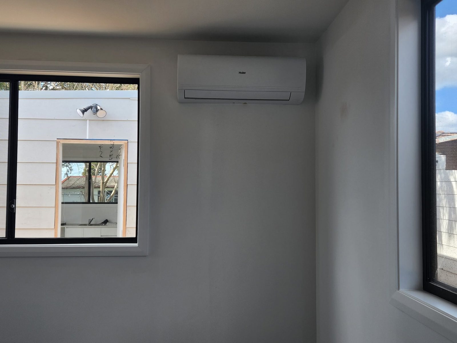 Newly installed Haier split system on an interior wall, ready to run