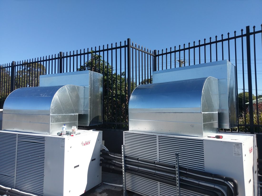 Large commercial refrigeration condenser units on site